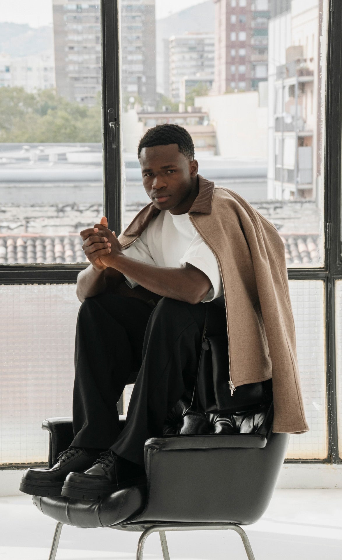 OPALE wool jacket in a city campaign portrait