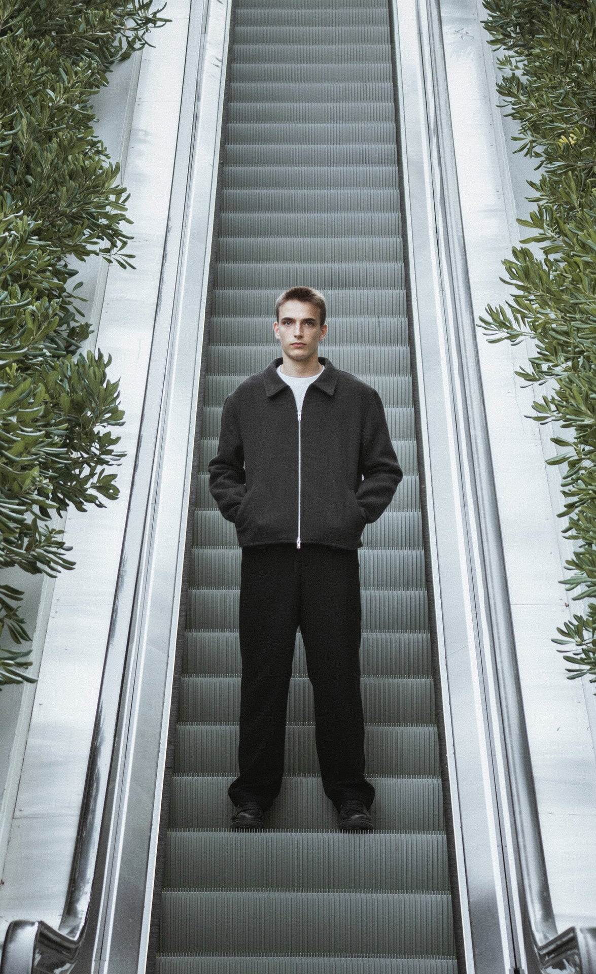 OPALE wool jacket on an escalator